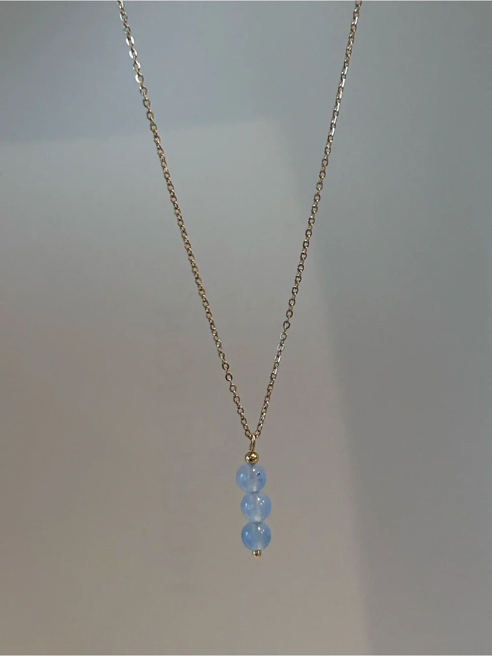 Gold Chain Necklace with Light Blue Bead Trio Pendant